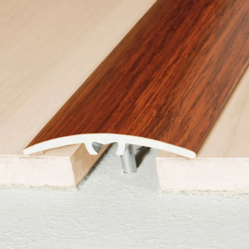 A64 40mm anodised aluminium door threshold strip installed between two floor surfaces in a UK home doorway.