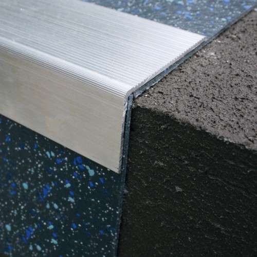 NRA50 retro fit aluminium stair nosing installed on stairs, providing slip resistance and edge protection for safety. 2