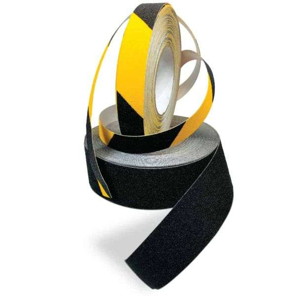 Silicone carbide safety tape applied to stair edge for slip resistance and improved safety on indoor and outdoor surfaces. 1