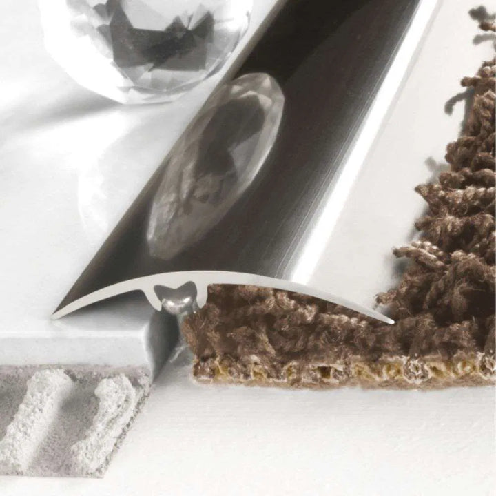 A65 50mm aluminium wood effect door threshold strip installed at a doorway in a UK home, blending floors neatly.